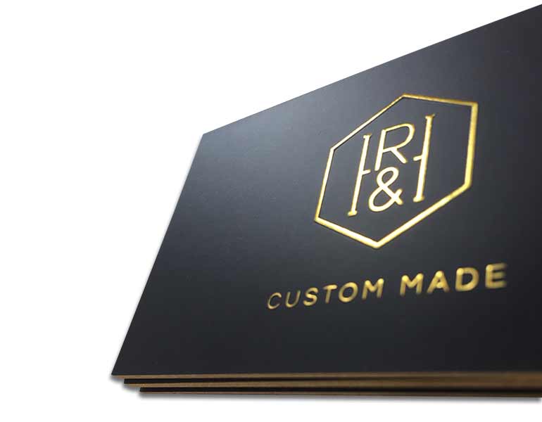 close-up-of-gold-foil-on-black-business-cards